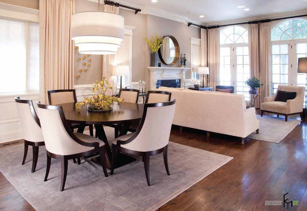 Interior visualisation of a dining area with a round table beside a lounge