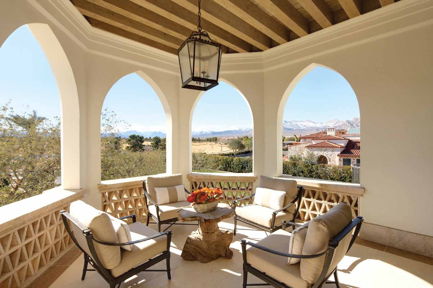 Illustrative image of a covered terrace with arched openings and outdoor seating